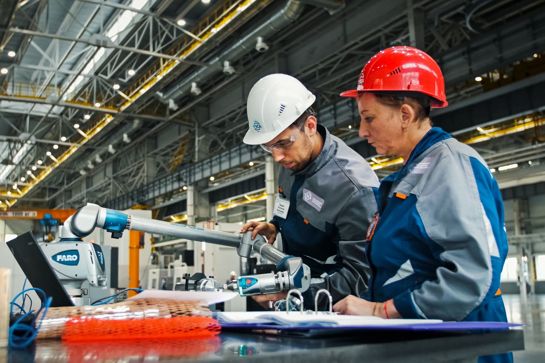 Workers Using a Factory Machine 